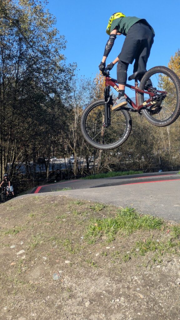 Prevelo Bravo Four boosting off a pump track lip
