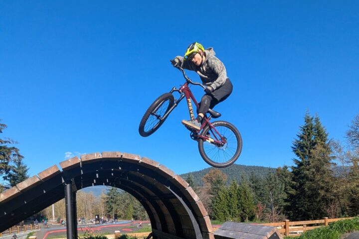 Rider sending the Prevelo Bravo Four over a whale-tail feature