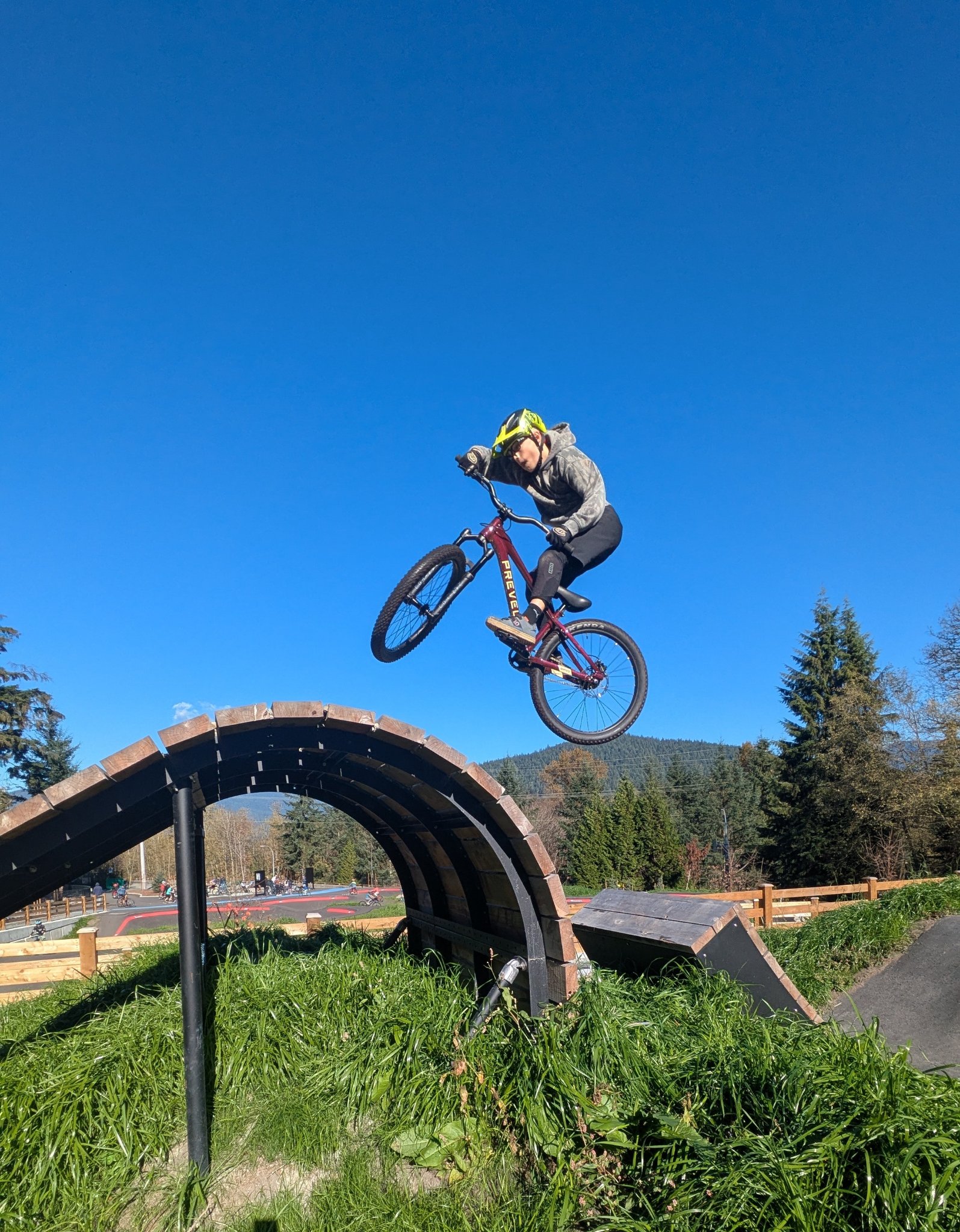 Rider sending the Prevelo Bravo Four over a whale-tail feature